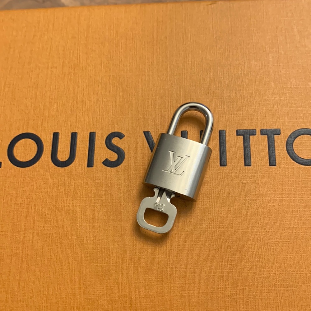Louis Vuitton silver key and lock #314